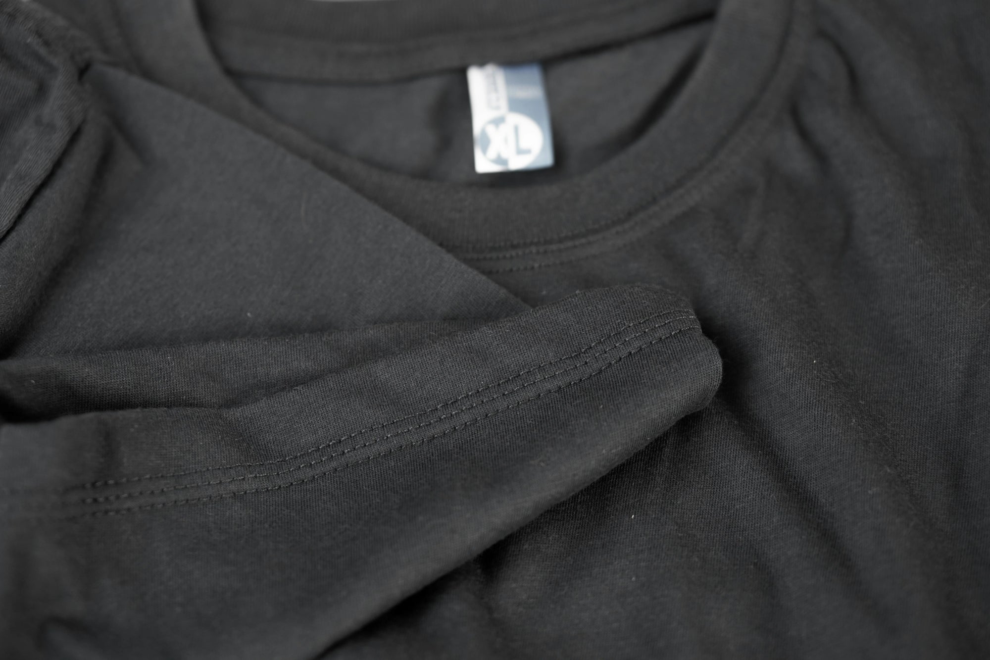 A close up of a tee with tag on it